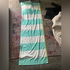 Teal and white striped curtain panels